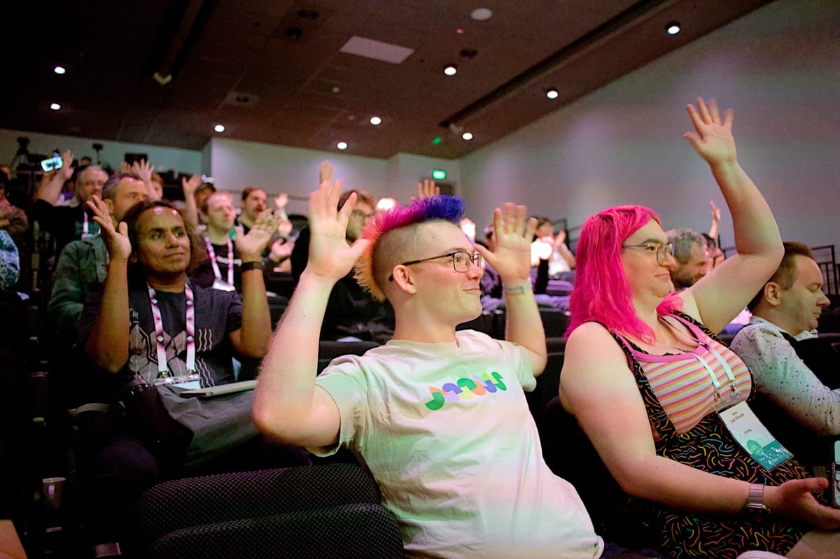 A photo of me applauding the Kiwi PyCon keynote. Photo by Kristina D.C. Hoeppner